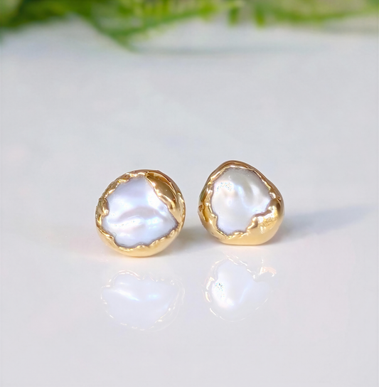 Gold freshwater pearl stud earrings from the 'Pea in a Pod' collection, showcasing unique creamy-white Keshi pearls.