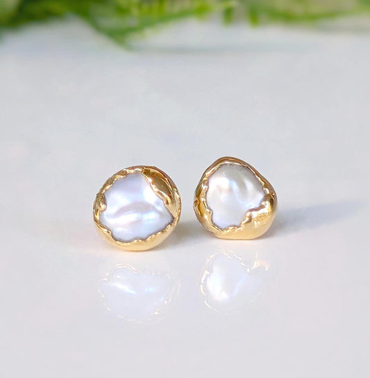 Gold freshwater pearl stud earrings from the 'Pea in a Pod' collection, showcasing unique creamy-white Keshi pearls.