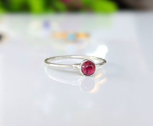 Dainty Ruby stacking ring in 18k Gold with a 4mm natural Ruby on a minimalist silver band.