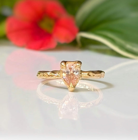 Peach Morganite textured ring in Solid 14k Gold with pear-shaped stone and organic band.