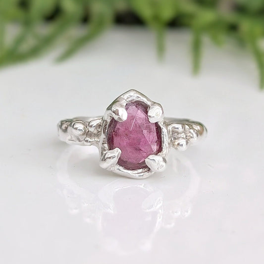 Pink Sapphire engagement ring in solid sterling silver with textured band and unique design.