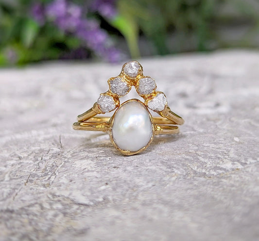 Freshwater pearl and raw diamond chevron wedding ring set in solid 14k gold, showcasing rustic elegance.