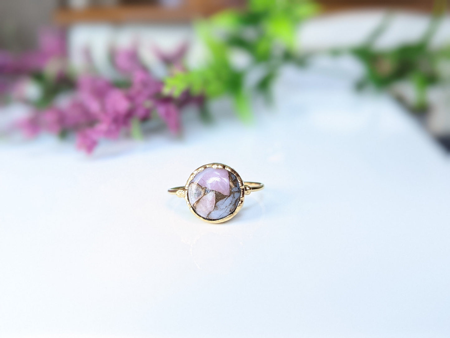 Handcrafted Pink Opal copper ring on gold band, featuring unique gemstone design, perfect for stylish accessories.