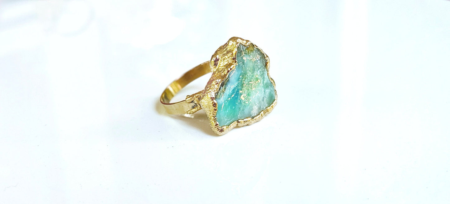 Handcrafted raw Peruvian opal ring with aqua blue stone set in a 14k gold filled band.
