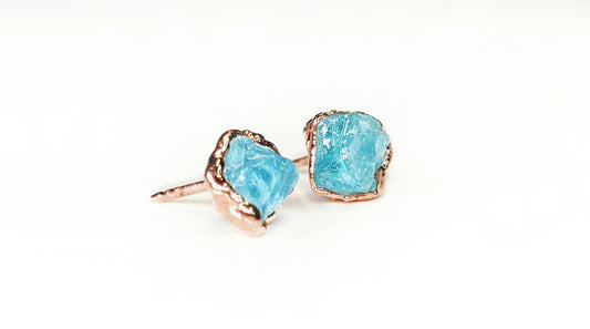 Dainty raw Aquamarine stud earrings in 18k gold plating, showcasing unique rough stones perfect for March birthdays.