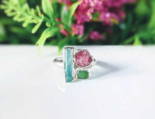 Raw Tourmaline multi-stone cluster ring featuring blue, pink, and green stones on a silver band.