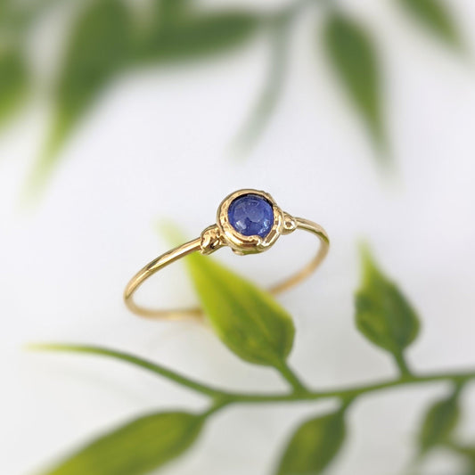 Dainty stacking ring with a 4mm natural blue Sapphire gemstone set on a 14k gold filled band.