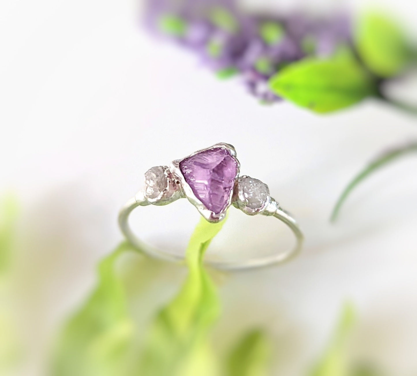 Stunning raw Alexandrite and diamond silver ring, handcrafted in Fine Silver, symbolizing love and unique style.