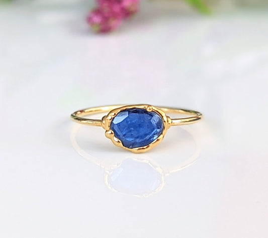 Blue rose-cut Kyanite ring set on a delicate solid 14k Gold band, showcasing its sparkly gemstone beauty.