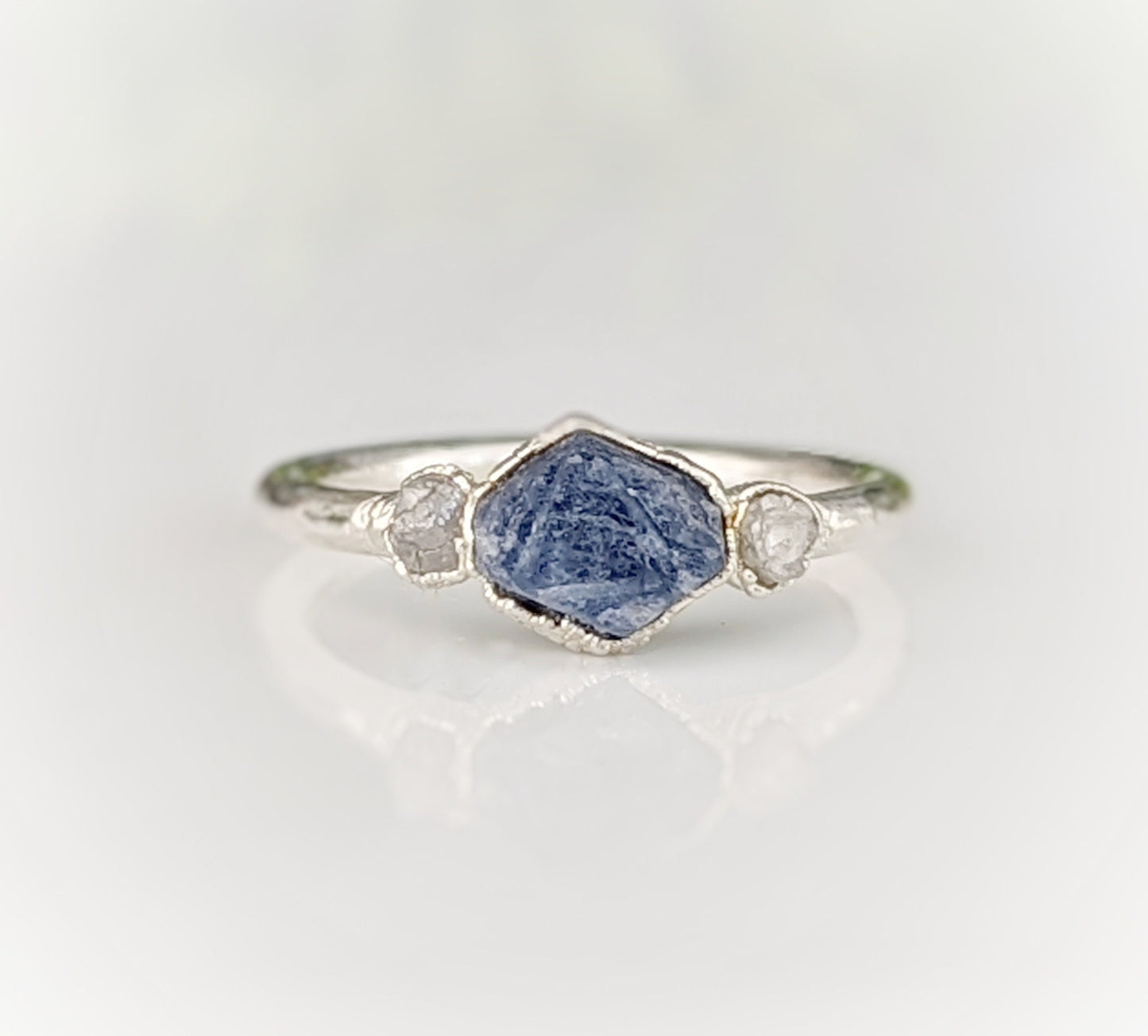 Raw sapphire and rough diamond ring, showcasing unique rustic beauty and ethical craftsmanship.