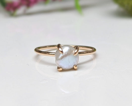 Freshwater Keshi pearl solitaire ring set in 18k gold, symbolizing love and elegance, perfect for engagement or special occasions.
