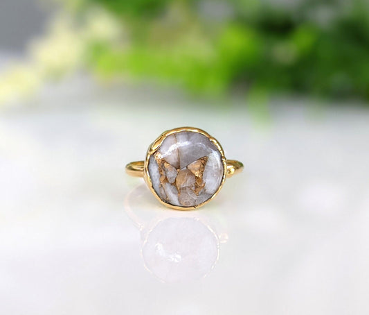 White Crystal and Copper ring set on an 18k Gold plated band, featuring a unique 12mm round gemstone.