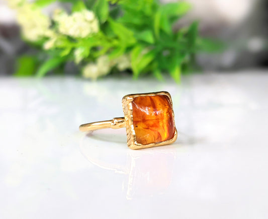 Baltic Amber gold ring featuring a honey-colored square amber stone on a 14k gold-filled band.