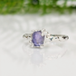 Handcrafted silver Tanzanite ring featuring a textured band and oval purple gemstone, perfect for unique elegance.