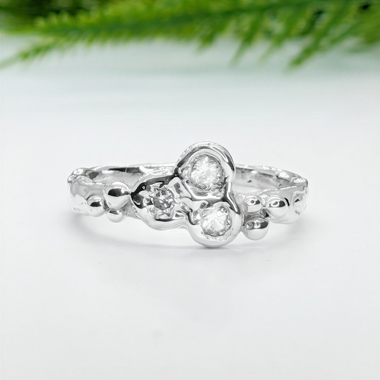 Silver CZ Cluster ring showcasing a handcrafted organic molten band and dazzling cubic zirconia stones.