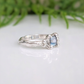 Handcrafted London Blue Topaz engagement ring in solid sterling silver with an organic textured band.