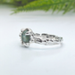 Handmade raw Montana Sapphire ring photographed outdoors with natural greenery