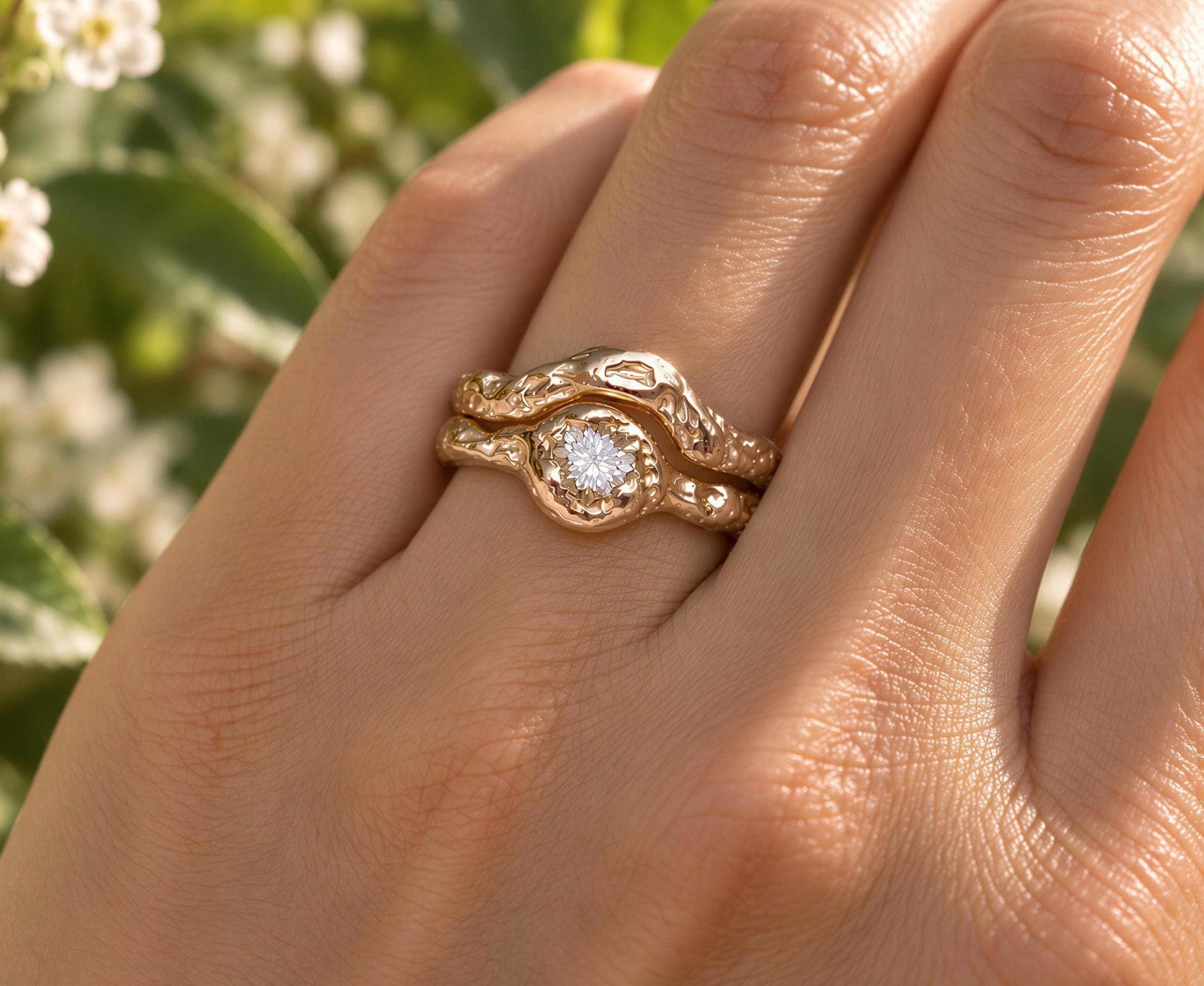 A close-up of a gold ring with a diamond set in the center, worn on a person's hand.