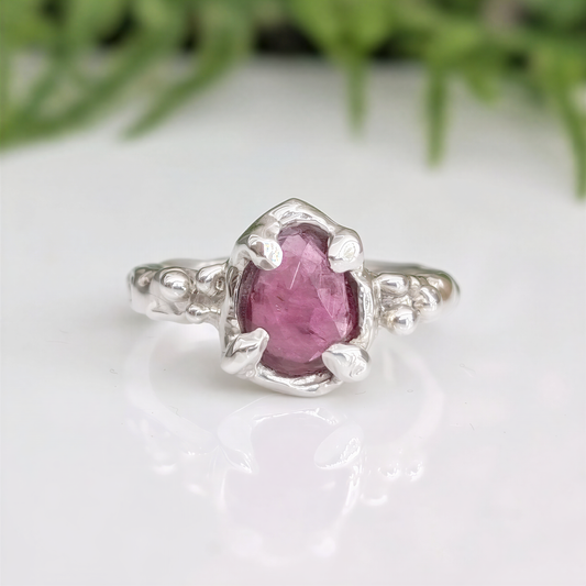 Pink Sapphire engagement ring in solid sterling silver with textured band and unique design.