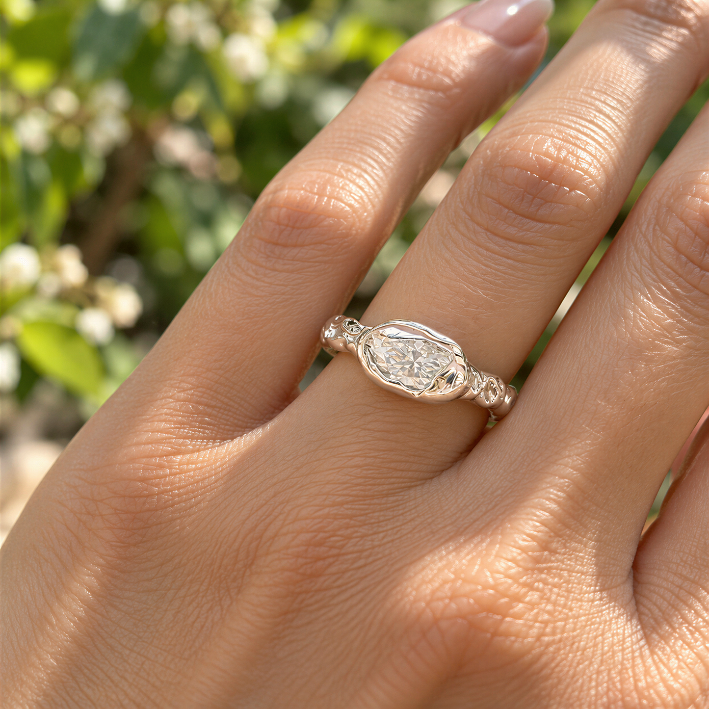 A close-up of a person's hand wearing a diamond engagement ring.