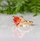 Orange Sapphire trilliant cut ring in solid 14k gold with textured band, showcasing unique handcrafted design.