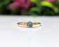 Raw blue diamond engagement ring on an 18k gold band, handcrafted and unique for special occasions.
