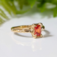 Radiant cut orange sapphire ring in solid 14k gold with unique textured band, perfect engagement or gift ring.