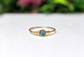 Raw blue diamond engagement ring on solid 18k gold band, handcrafted and unique, perfect for Valentine's Day.