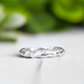 Molten Silver textured wedding band with an abstract, irregular design, handcrafted in solid sterling silver.