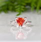 Trilliant cut Orange Sapphire ring in Solid 14k Gold, featuring a unique molten textured band, perfect for engagements.