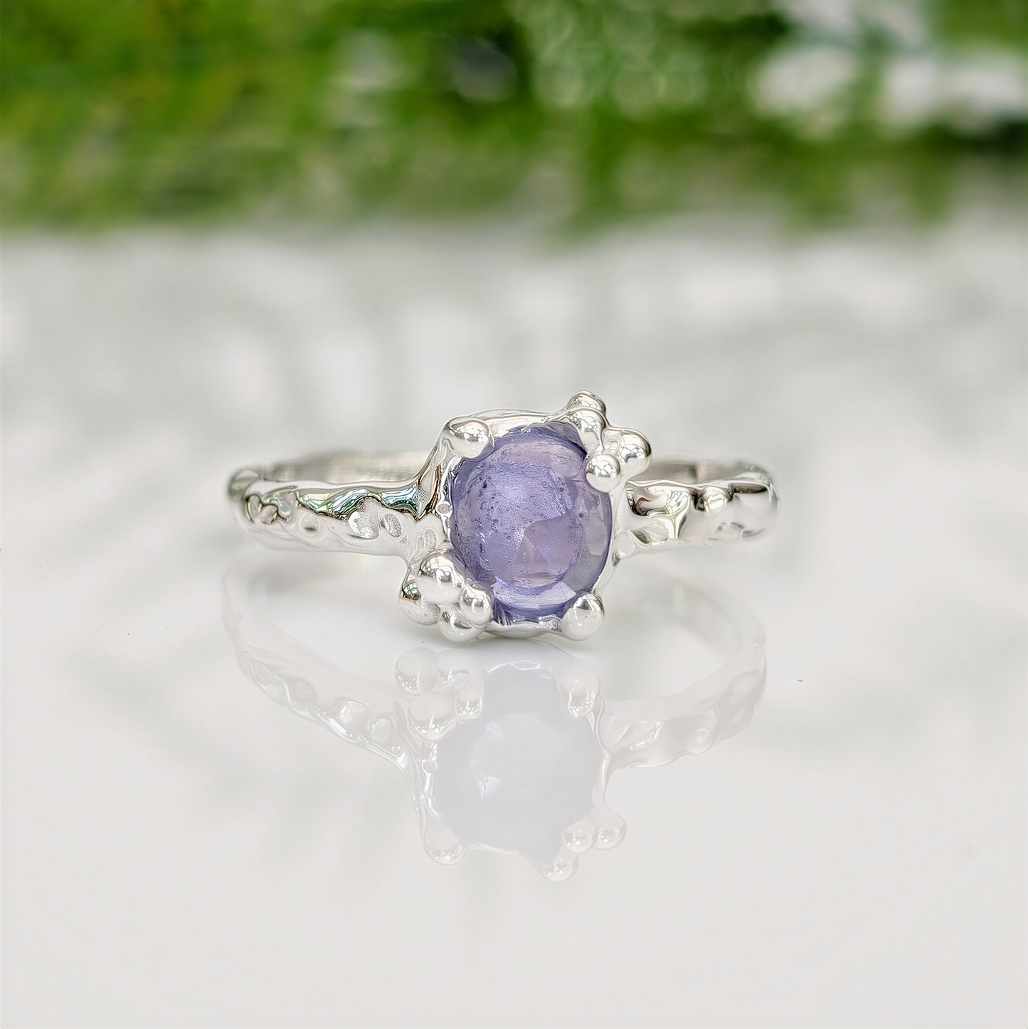 Handcrafted silver Tanzanite ring with organic texture, featuring a unique purple gemstone, ideal for meaningful gifts.