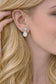 Close-up of a woman wearing a pair of Aquamarine and Opal Gold stud earrings