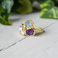 Custom family birthstone ring featuring raw gemstones in gold setting, perfect for unique heirloom jewelry.
