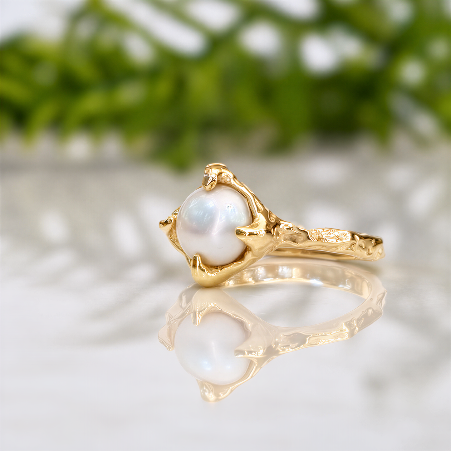 Side view of natural Keshi pearl in handcrafted solid gold ring