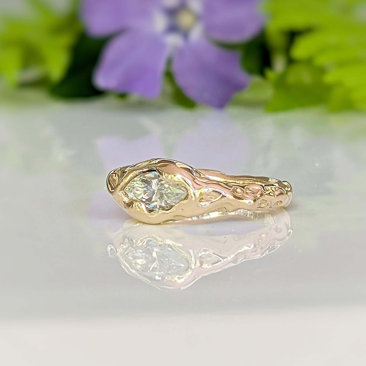 Moissanite Engagement Ring - Solid 14k Gold Textured Band featuring a marquise stone on a textured band.