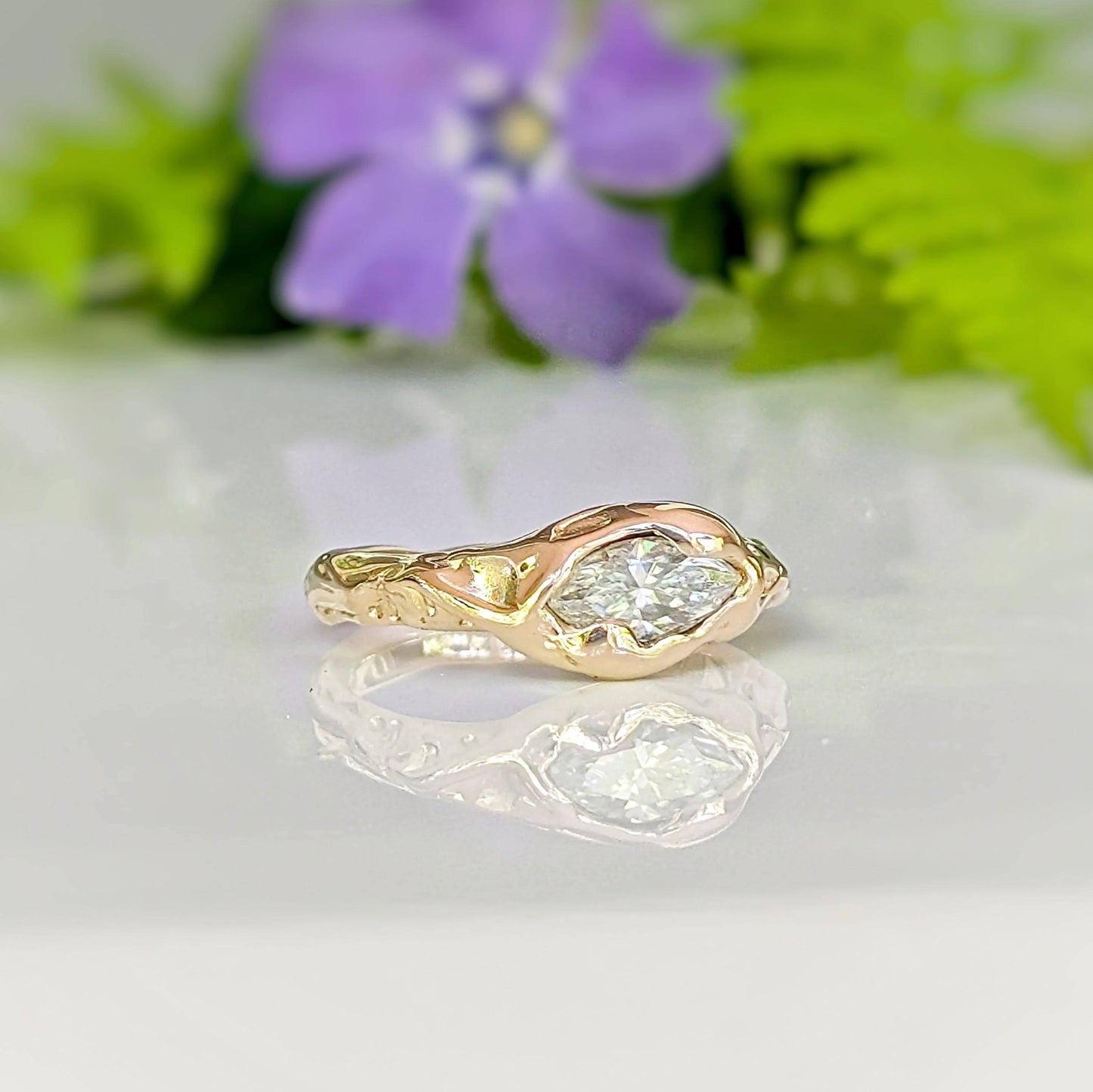 Moissanite Engagement Ring - Solid 14k Gold Textured Band featuring a marquise stone on a textured band.