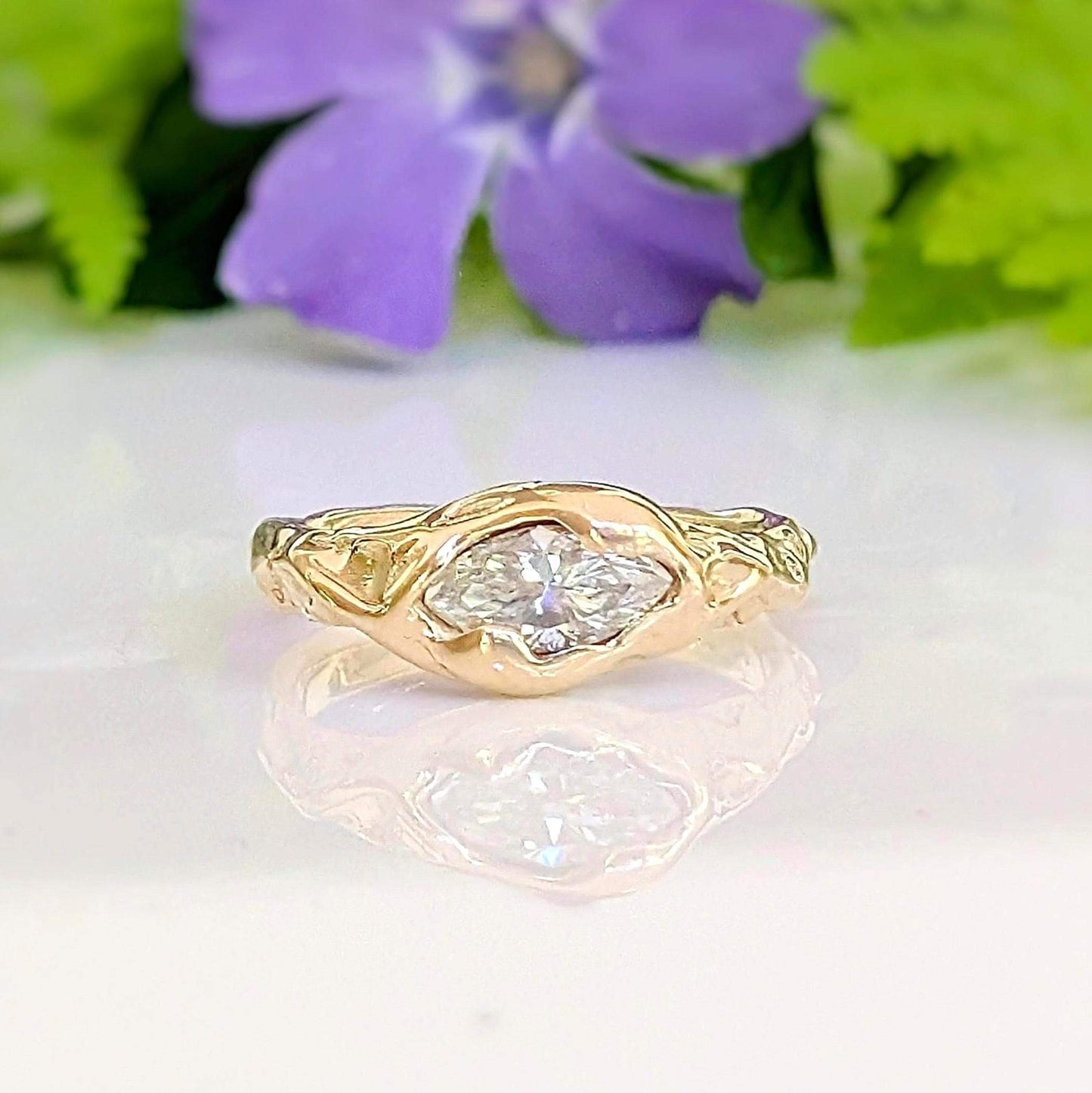 Moissanite Engagement Ring - Solid 14k Gold Textured Band featuring a marquise stone on a textured band.