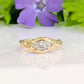 Moissanite Engagement Ring - Solid 14k Gold Textured Band featuring a marquise stone on a textured band.