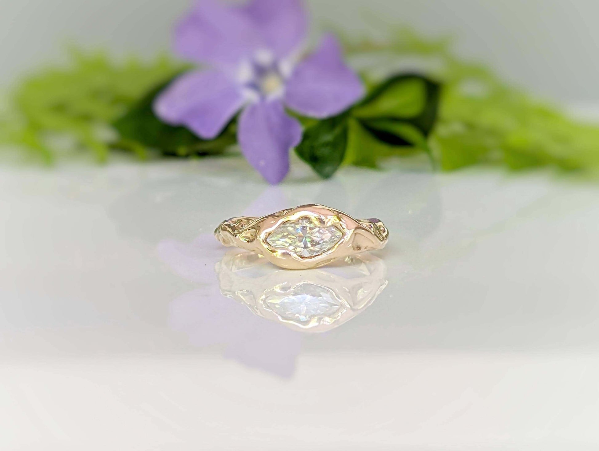 Moissanite Engagement Ring - Solid 14k Gold Textured Band featuring a brilliant marquise stone on a textured band.