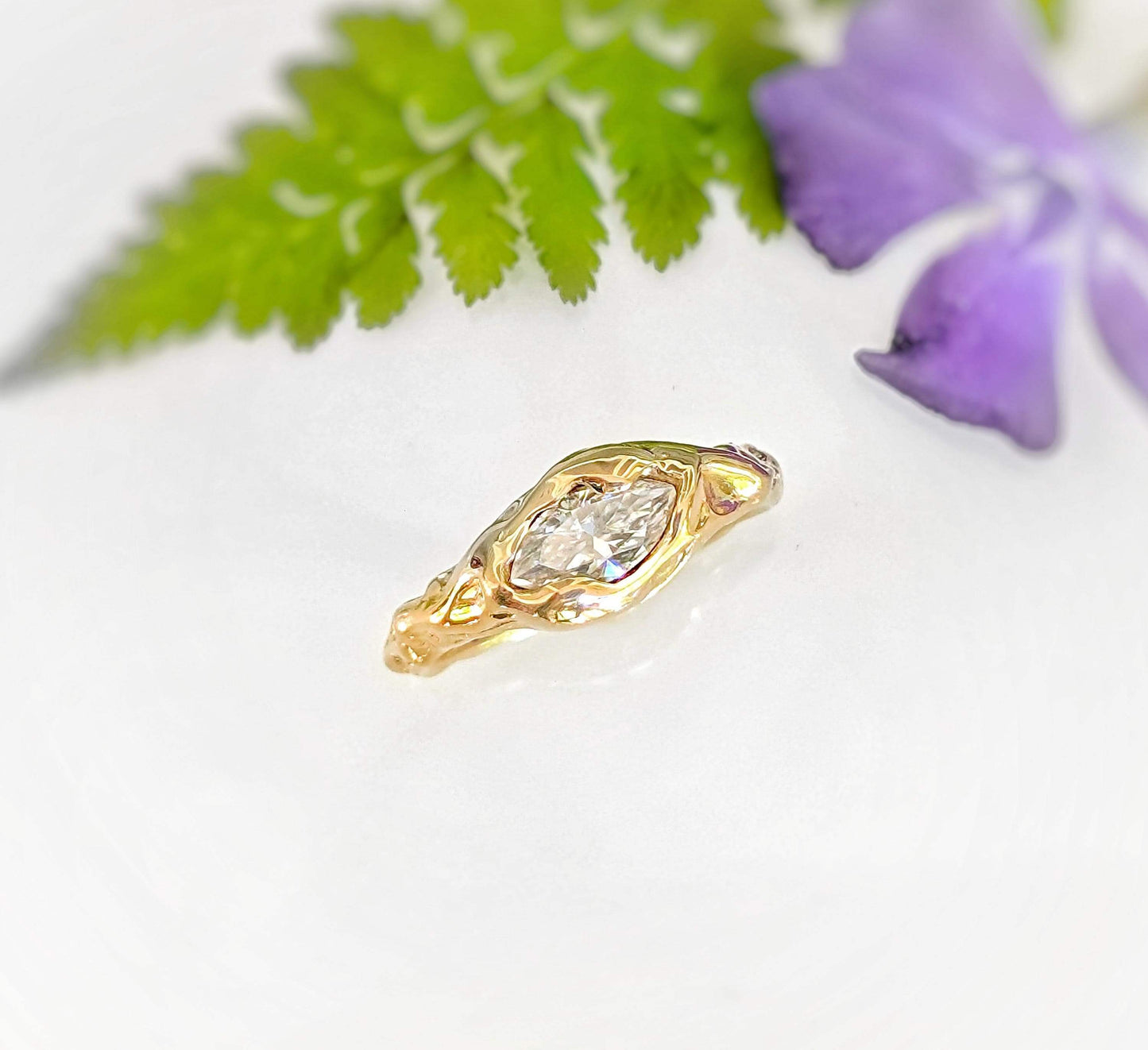 Moissanite Engagement Ring - Solid 14k Gold Textured Band featuring a marquise stone on a textured band.