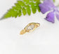 Moissanite Engagement Ring - Solid 14k Gold Textured Band featuring a marquise stone on a textured band.