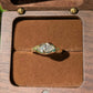 Moissanite Engagement Ring - Solid 14k Gold Textured Band displayed in a wooden jewelry box with a plush interior.