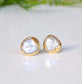 Gold freshwater pearl stud earrings from the 'Pea in a Pod' collection, showcasing unique creamy-white Keshi pearls.