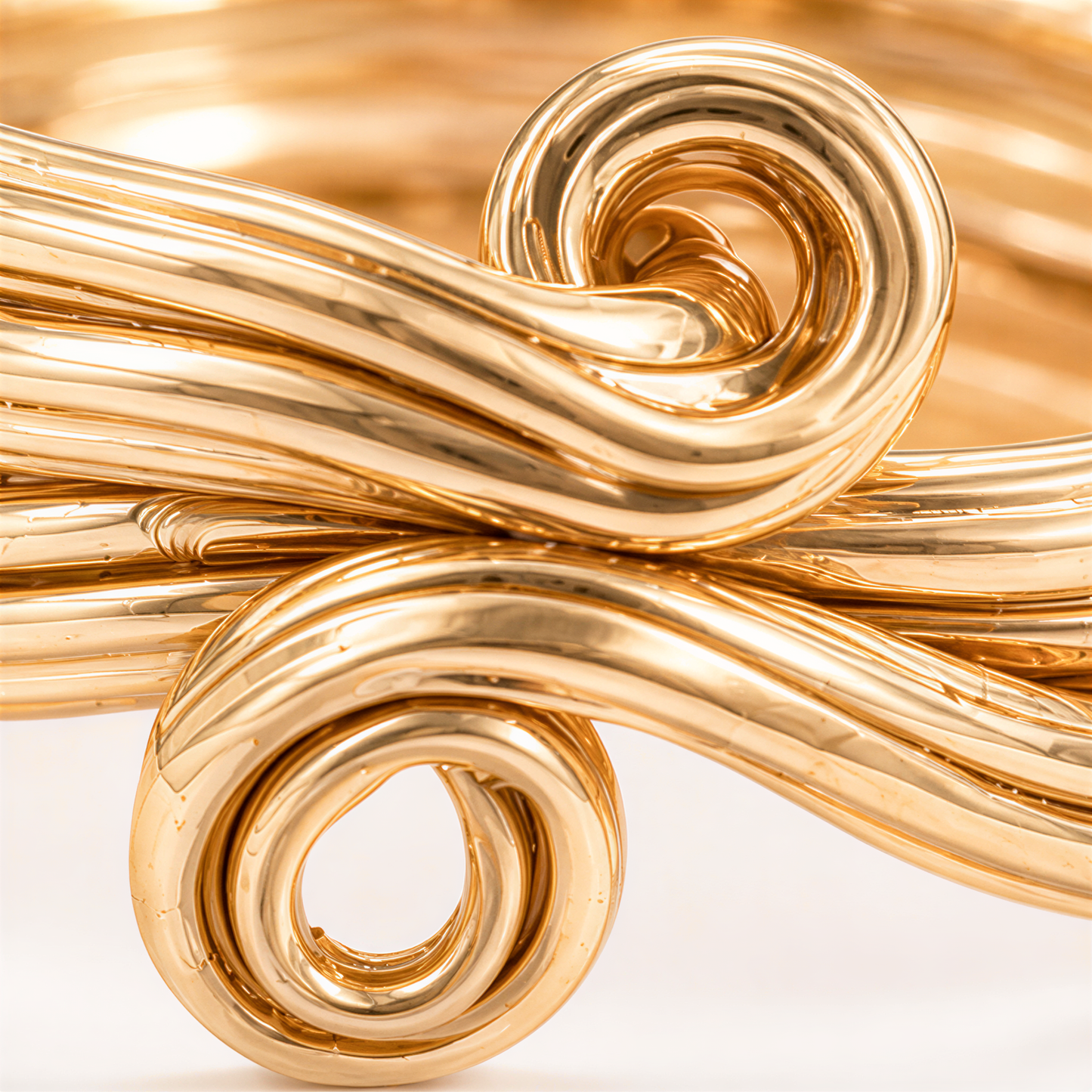 A close-up view of a Gold, textured & twisted ring.