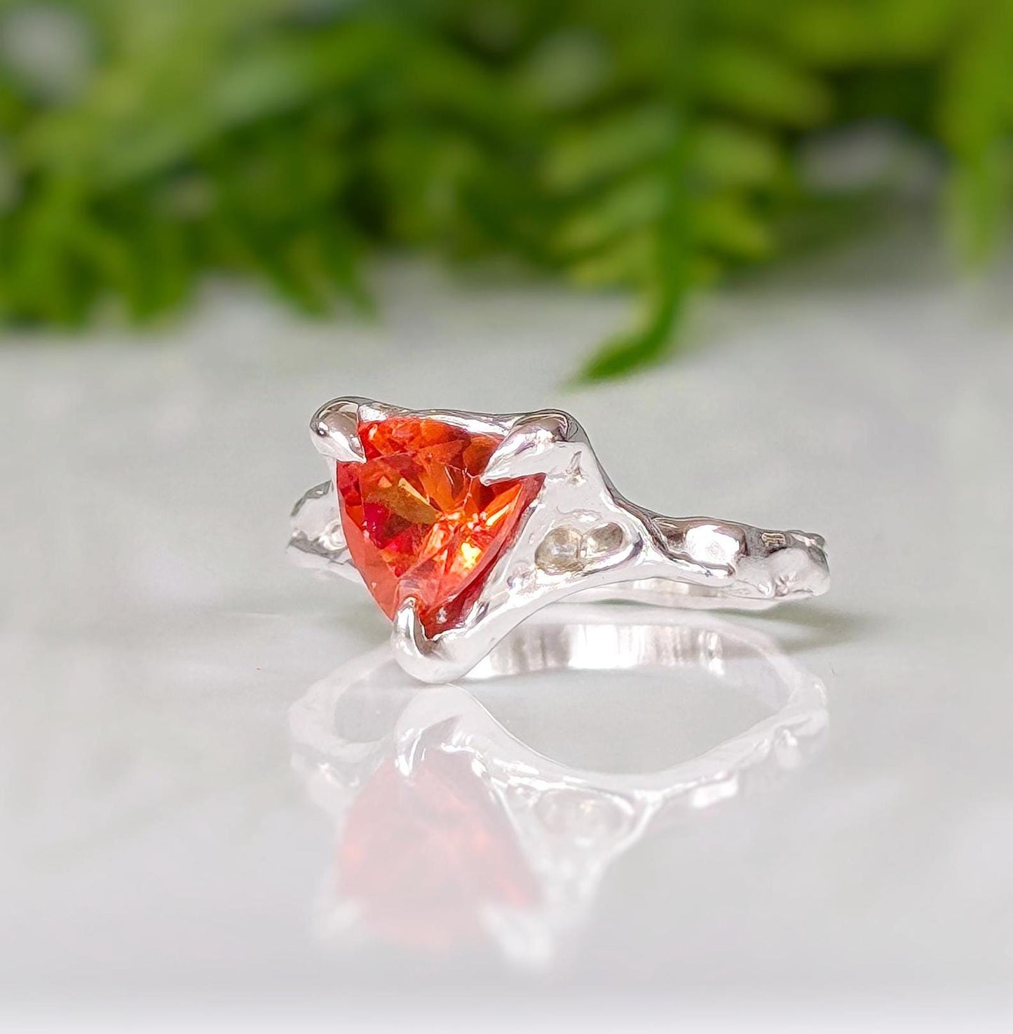 Stunning trilliant cut Orange Sapphire ring in textured solid 14k Gold, showcasing radiant craftsmanship and unique design.