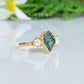 Raw green sapphire and herkimer diamond engagement ring on gold band, unique handcrafted jewelry for special occasions.