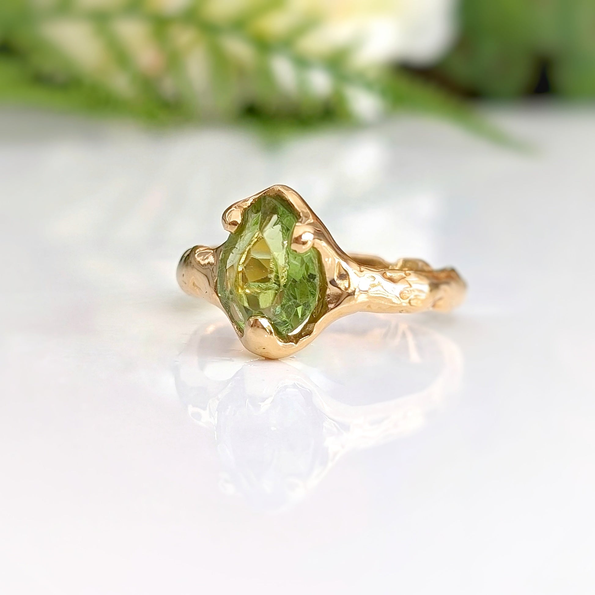 Handcrafted sterling silver Peridot ring with organic textured band, showcasing rose cut gemstone, perfect for August birthdays.