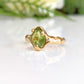 Handcrafted sterling silver Peridot ring with organic textured band, showcasing rose cut gemstone, perfect for August birthdays.