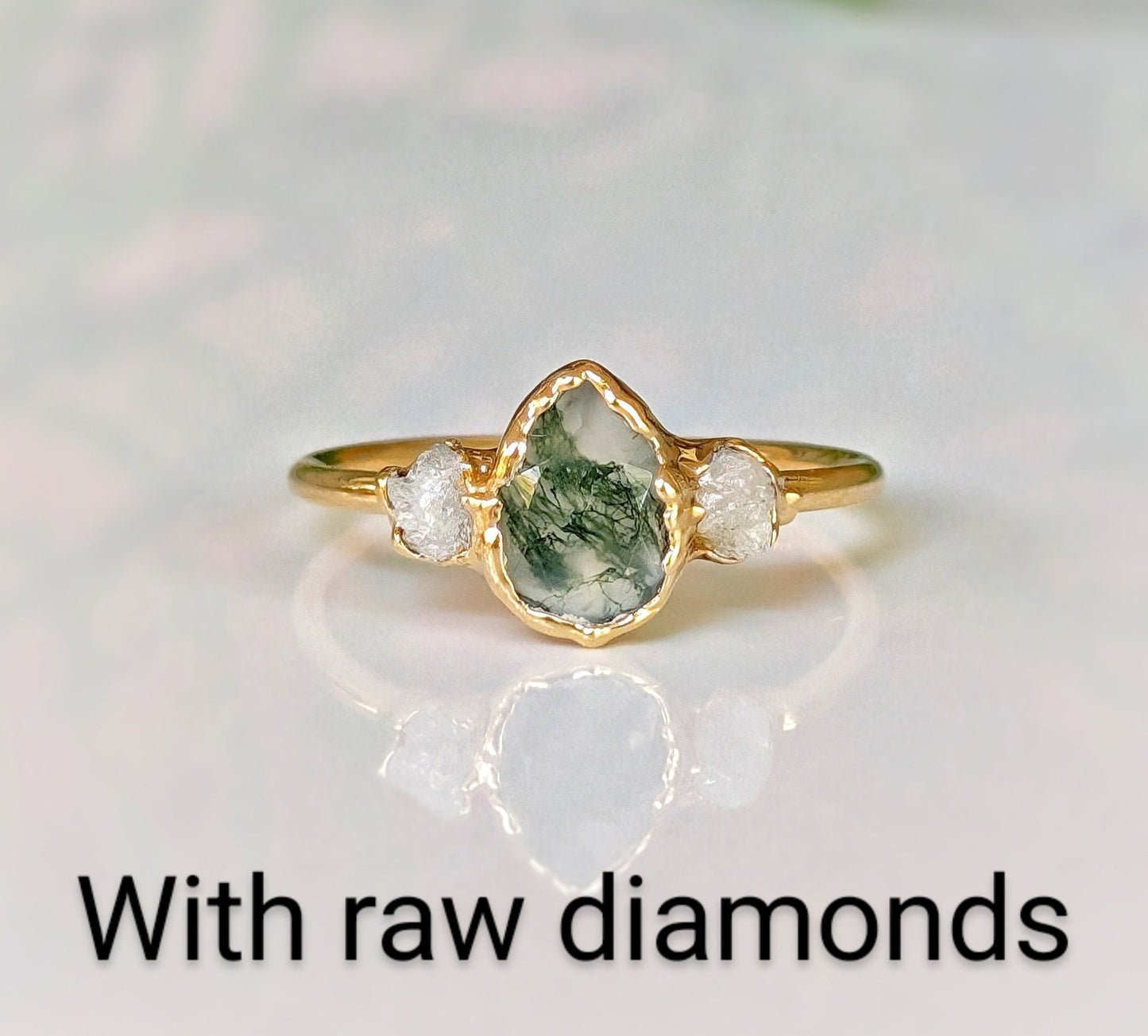 Pear-shaped Moss Agate ring with raw Herkimer diamonds on a 14k gold band.