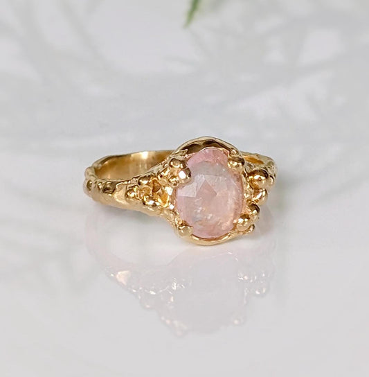 Handcrafted pink Morganite ring in solid 14k gold, featuring oval rose cut gemstone and textured band.